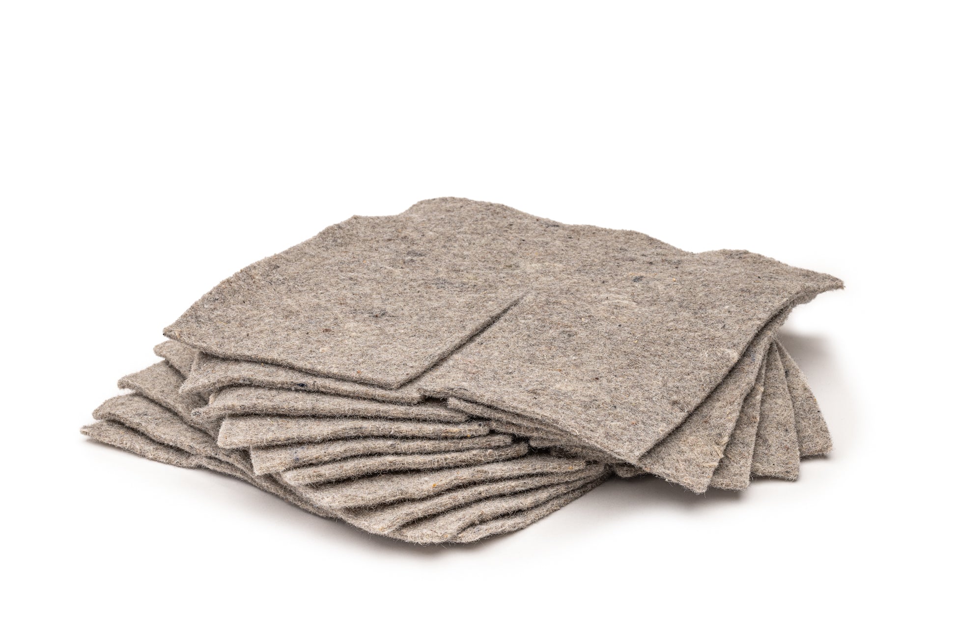Close-up view of recycled wool mulch mat squares with natural fibre texture