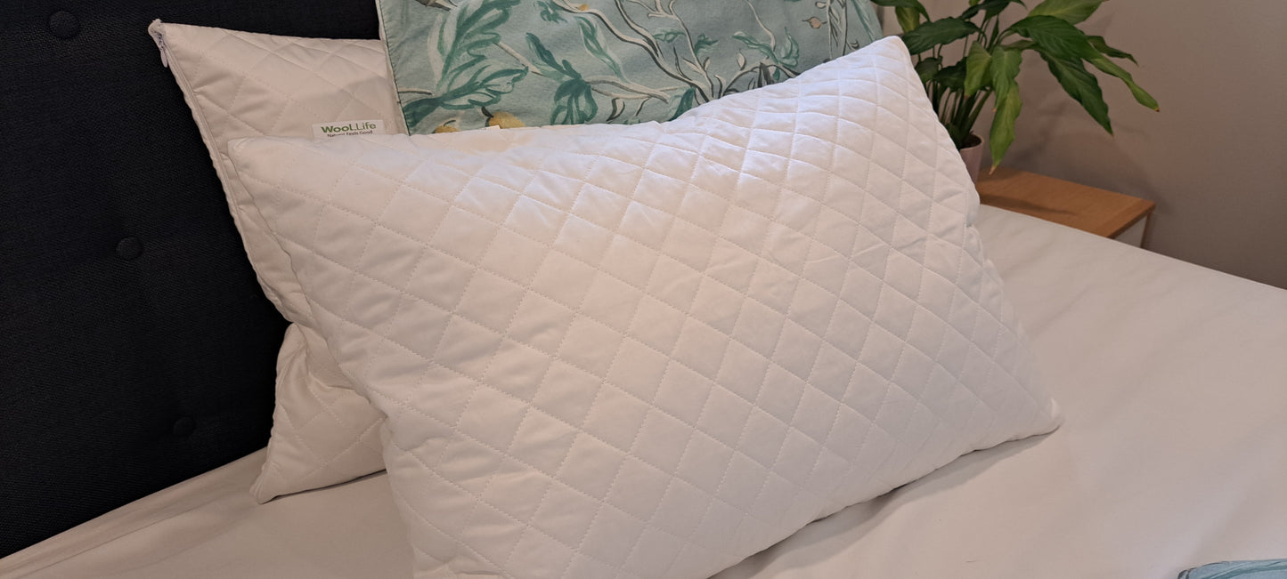 Wool.Life natural wool pillow on bed promoting healthy sustainable sleep