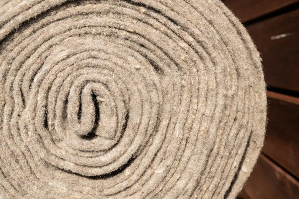 Close-up of recycled NZ wool mulch mat roll fibres - natural biodegradable weed mat texture